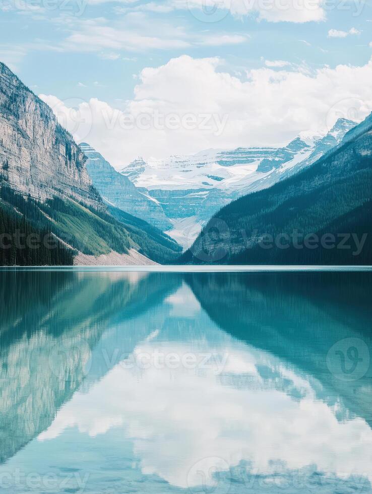 A lake surrounded by mountains and trees photo