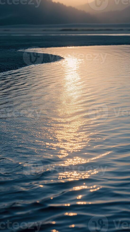Calm water reflects sunset glow photo