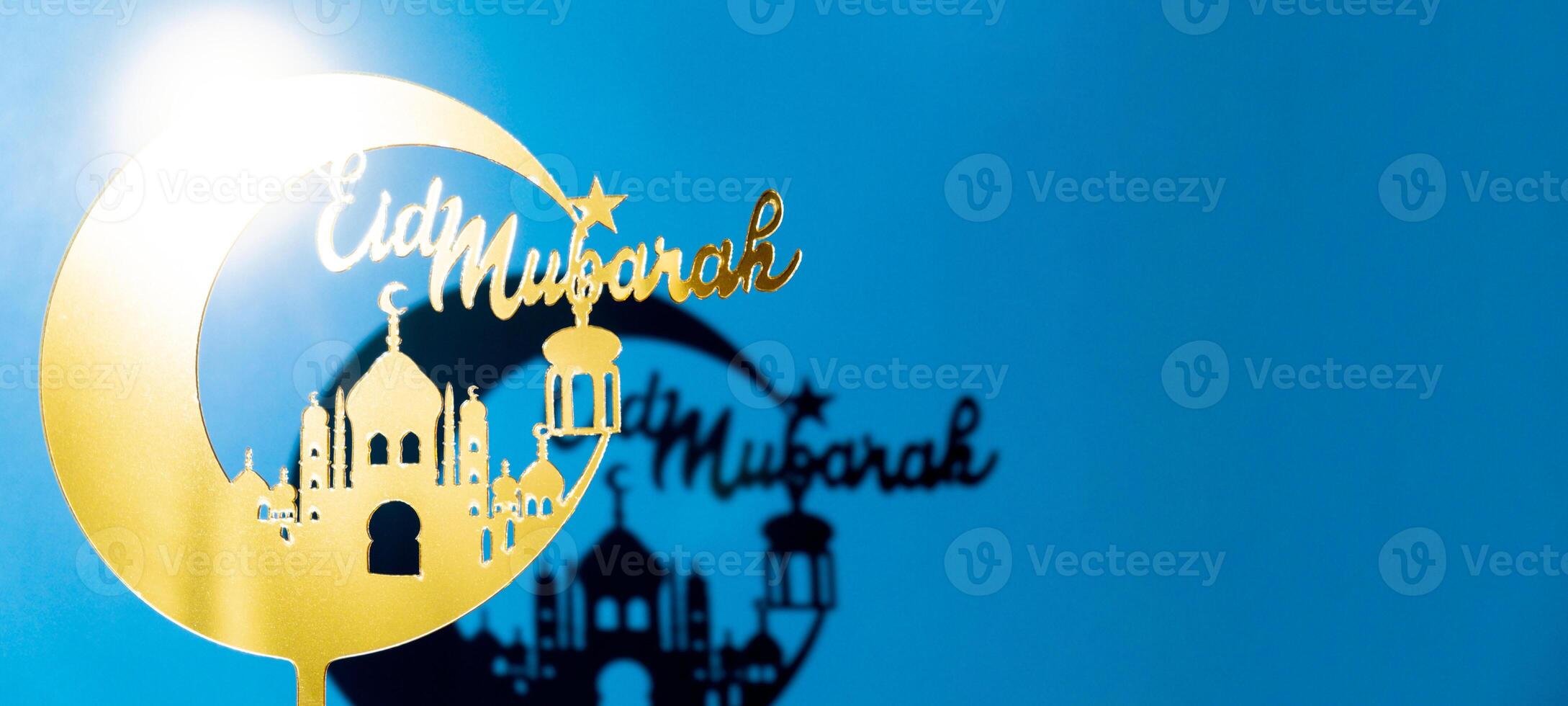 Crescent moon with mosque. Traditional Islamic holiday greetings Eid Mubarak. Ramadan Kareem concept background. Creative light and shadows sunset lamp lantern. Islamic holiday poster Eid-Ul-Adha festival celebration photo