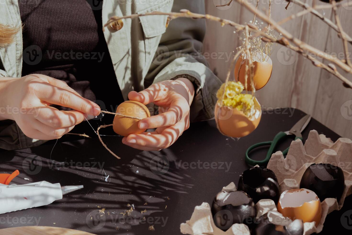 Tutorial How to make Easter table decoration with egg shells step by step instruction. Easter home decoration on wooden branch. Seasonal sustainable recycled decor photo