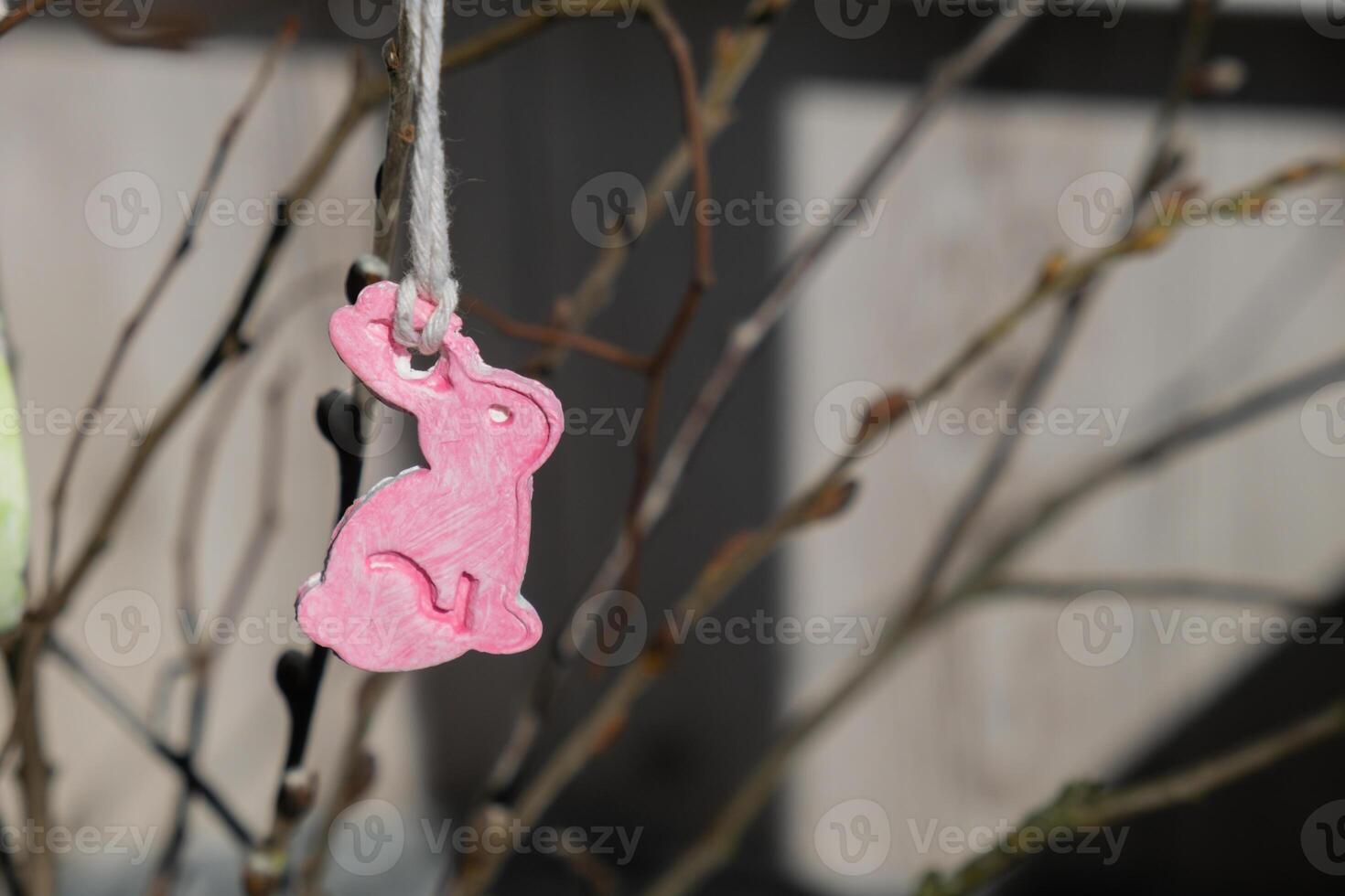 Do it yourself air dry clay crafts for Easter holiday. Decoration sustainable eco-friendly gift idea Handmade children craft. Step by step instruction of painting, pressing figures on wooden twig photo