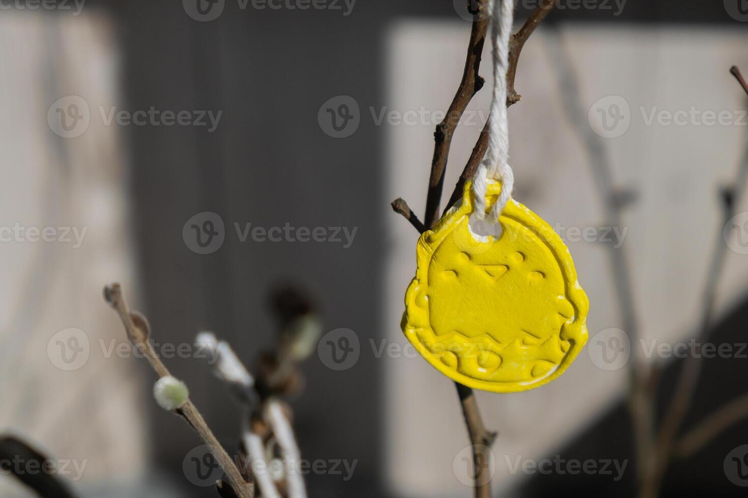 Do it yourself air dry clay crafts for Easter holiday. Decoration sustainable eco-friendly gift idea Handmade children craft. Step by step instruction of painting, pressing figures on wooden twig photo