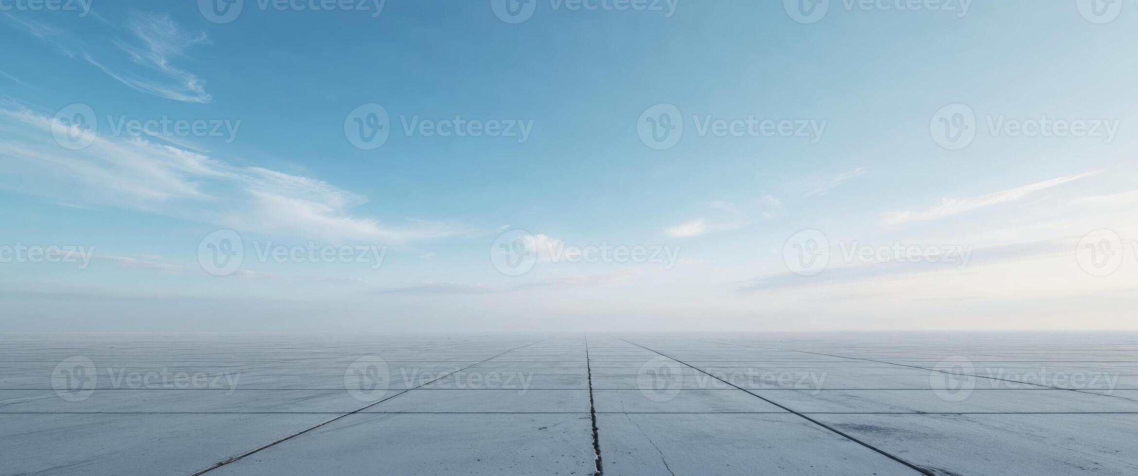 An empty concrete floor with sky in the background photo