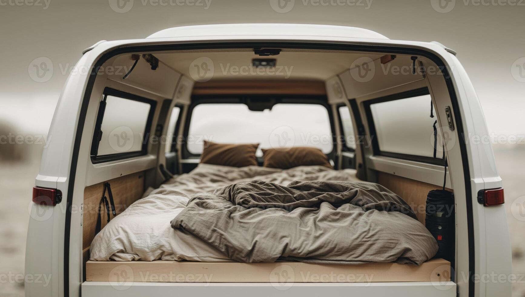 A bed in the back of a van photo