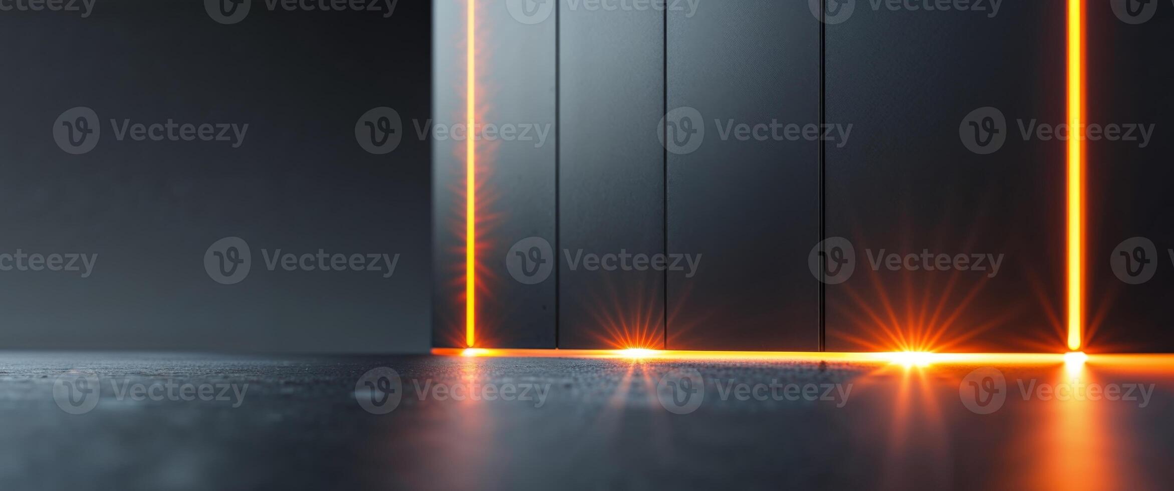 A dark room with orange lights on the wall photo