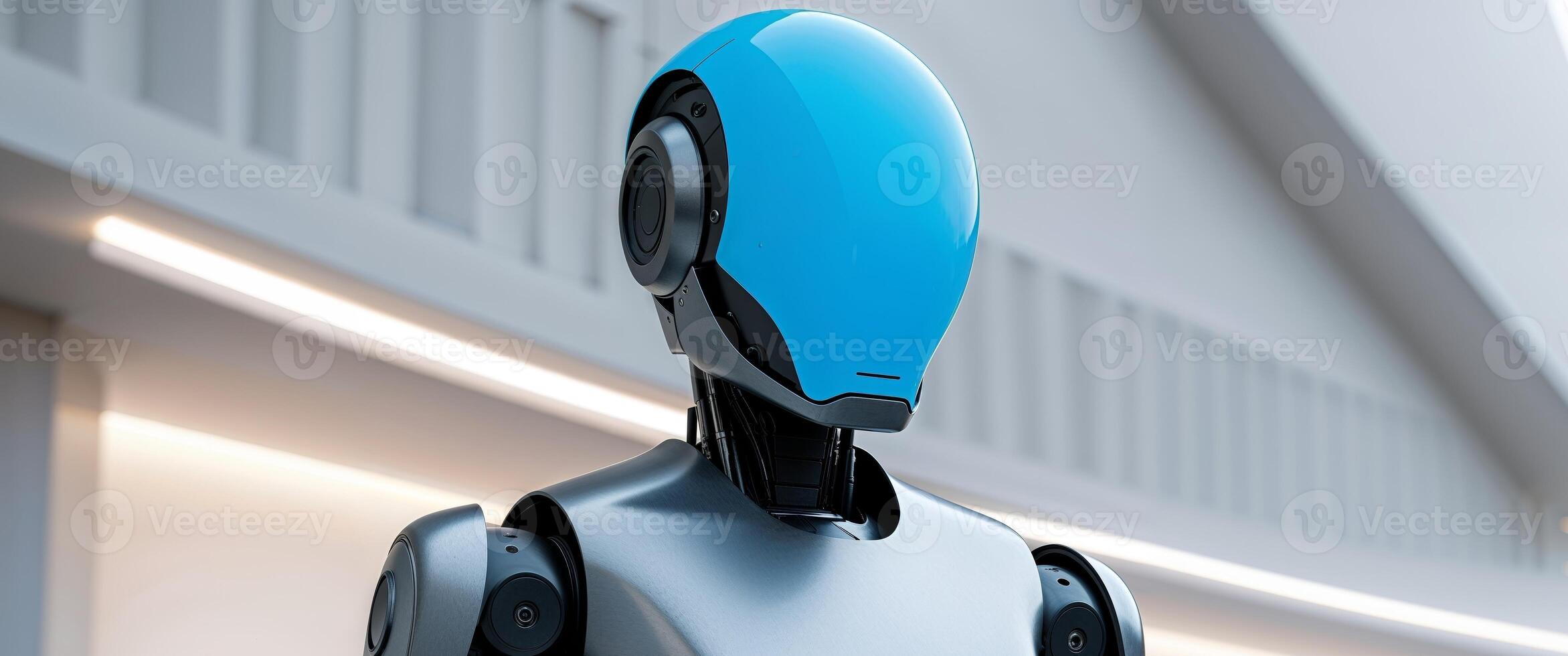 A robot with a blue head and a gray body photo