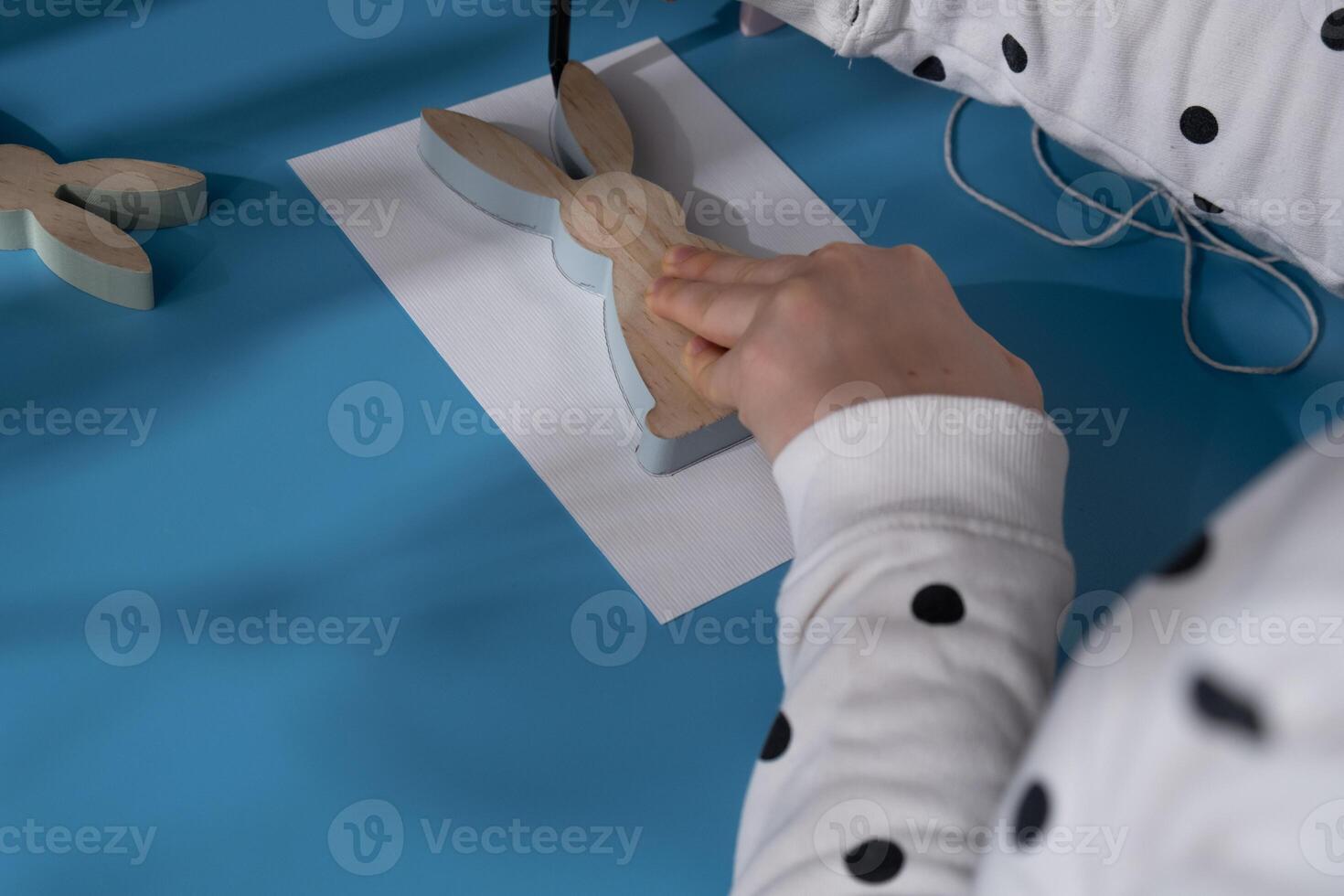 Creating Easter rabbit bunny with cotton rope Storytelling of creating craft Easter greeting card holiday present. Tactile hand-on activity. Master class progress of creative me-made gifts. Seasonal domestic life micro moment hobby. Sustainable living photo