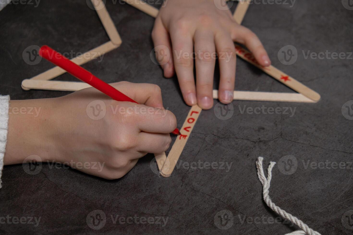 Ice cream sticks Christmas star Sustainable preparation Diy process making handmade decoration. Step by step activity for children. Inclusive and responsible stress relief holiday hobby. Conscious celebration photo