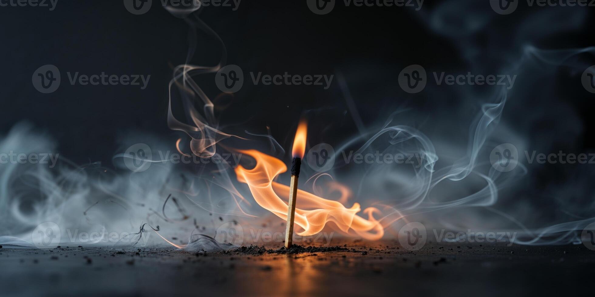 Flame and smoke dance from a lit match in a dark setting photo