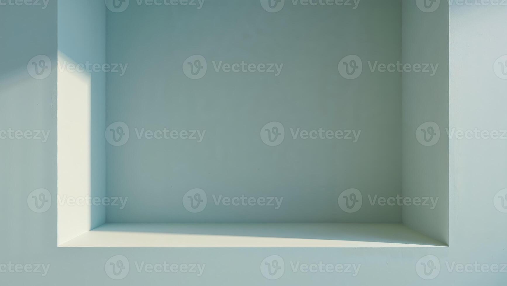 An empty recessed box built into a wall of light blue photo