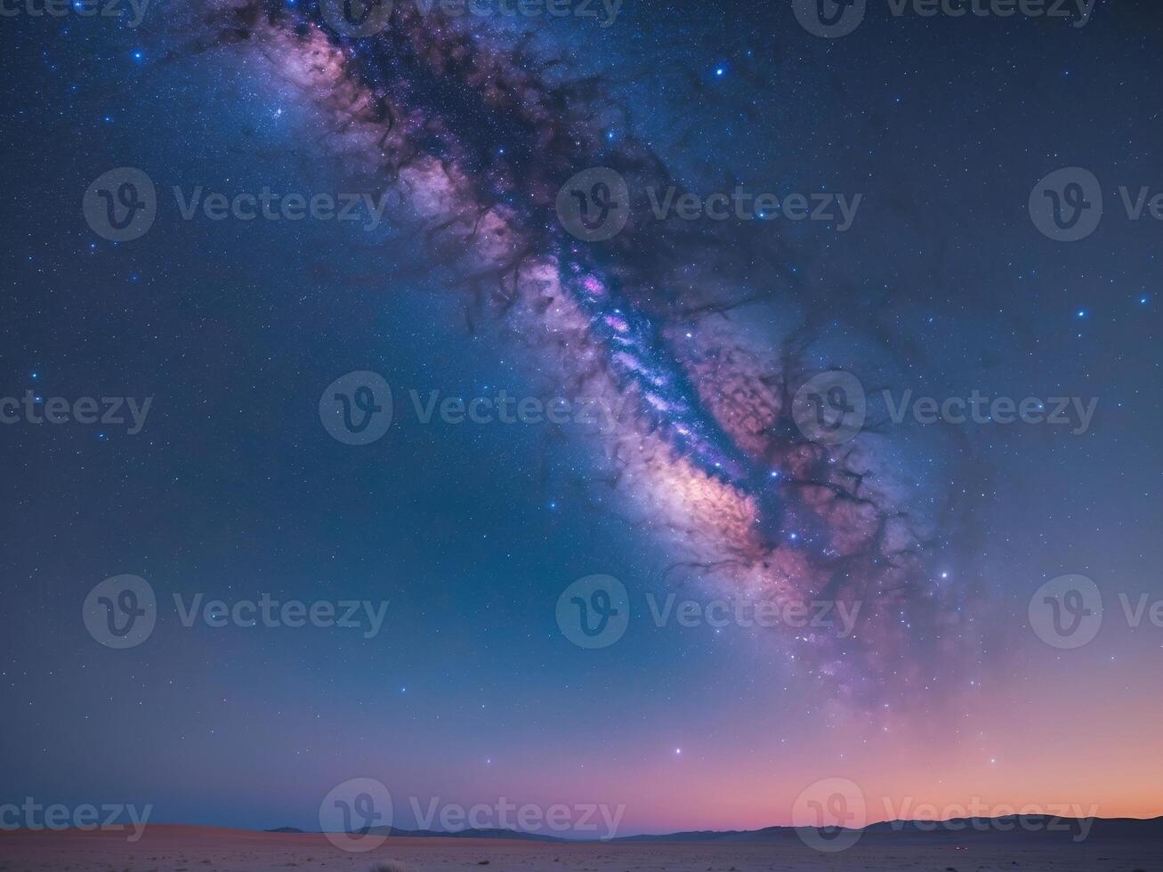The milky way over the desert at night photo