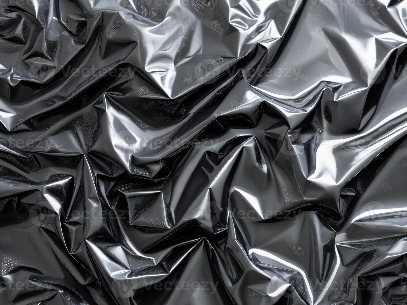 A black and white image of a shiny black fabric photo