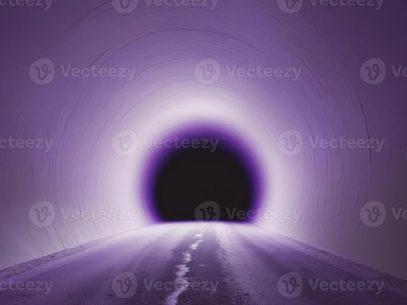 A dark tunnel with a bright light coming out of it photo