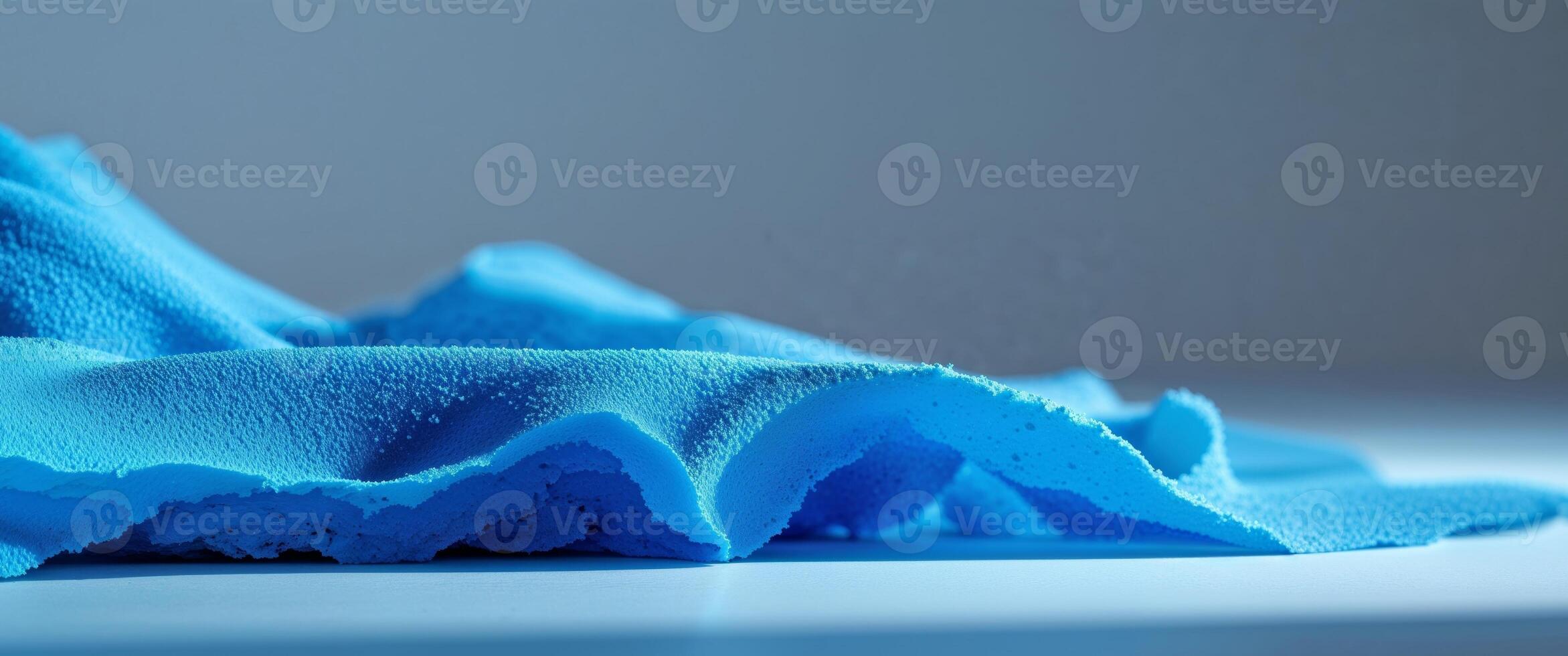 A blue cloth is sitting on top of a table photo