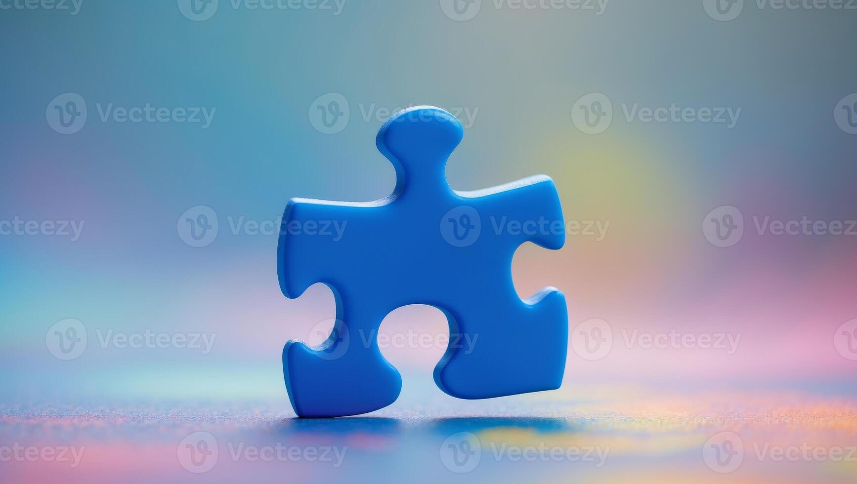Single blue puzzle piece representing uniqueness on softly blurred multicolored background photo