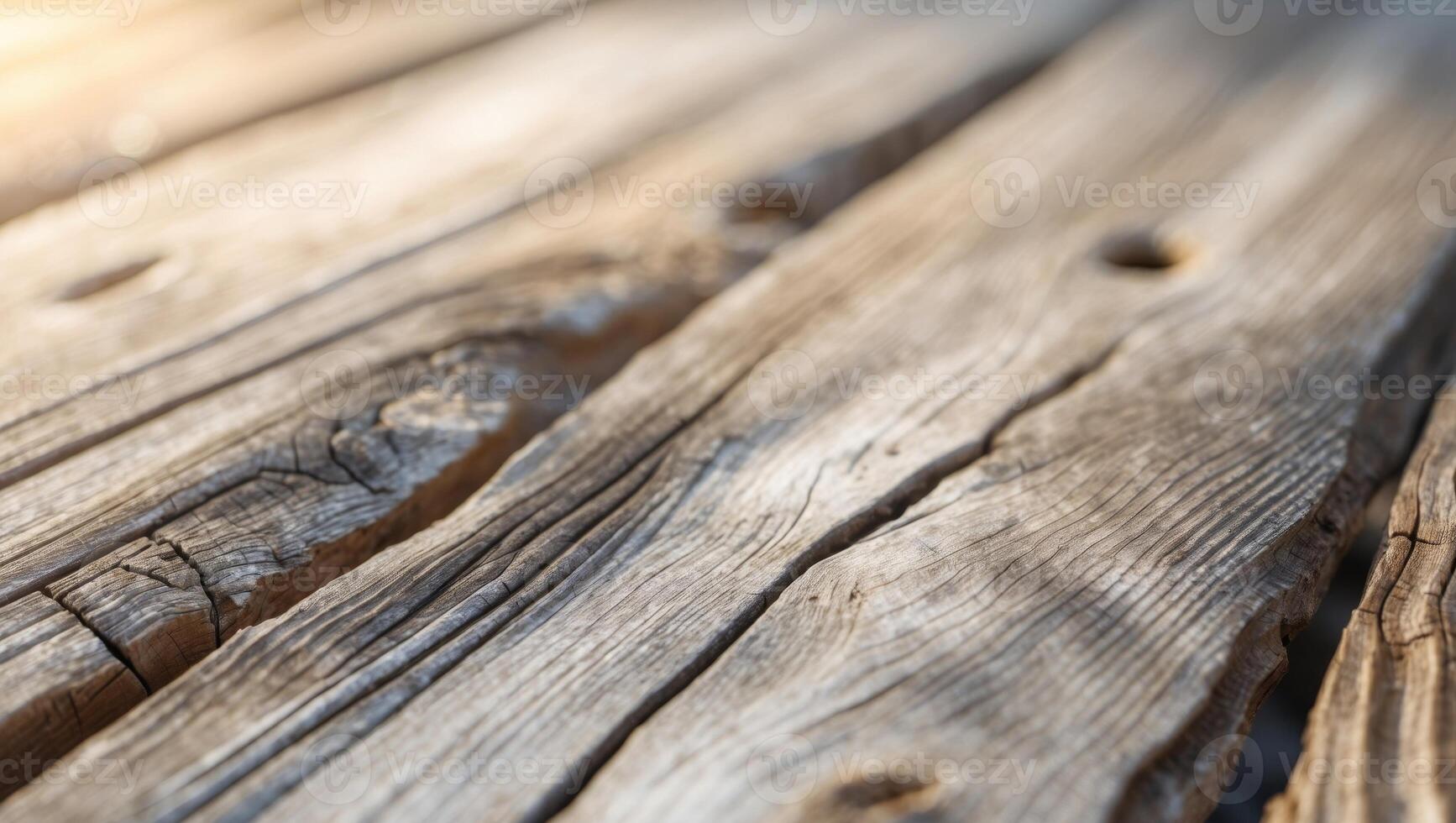 Closeup of a wooden table with sunlight shining through it photo