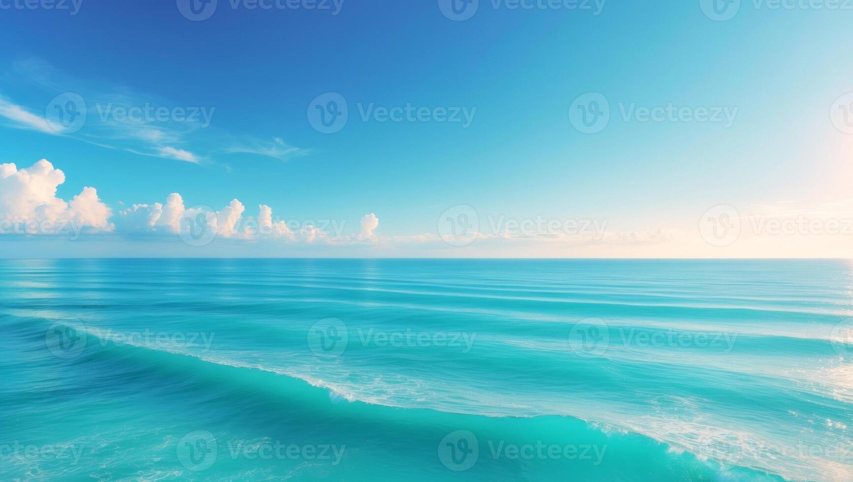 A beautiful blue ocean with waves and clouds photo