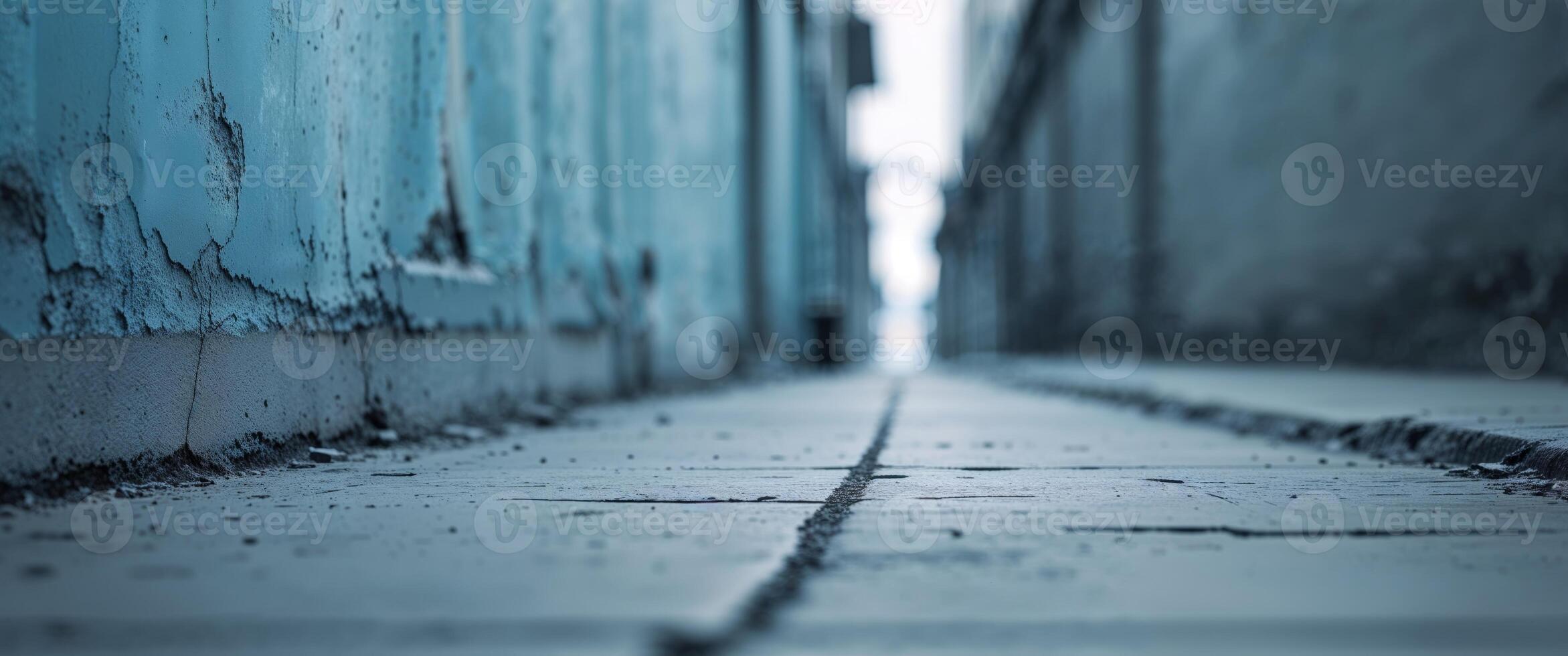 Old blue wall with sidewalk in perspective. photo