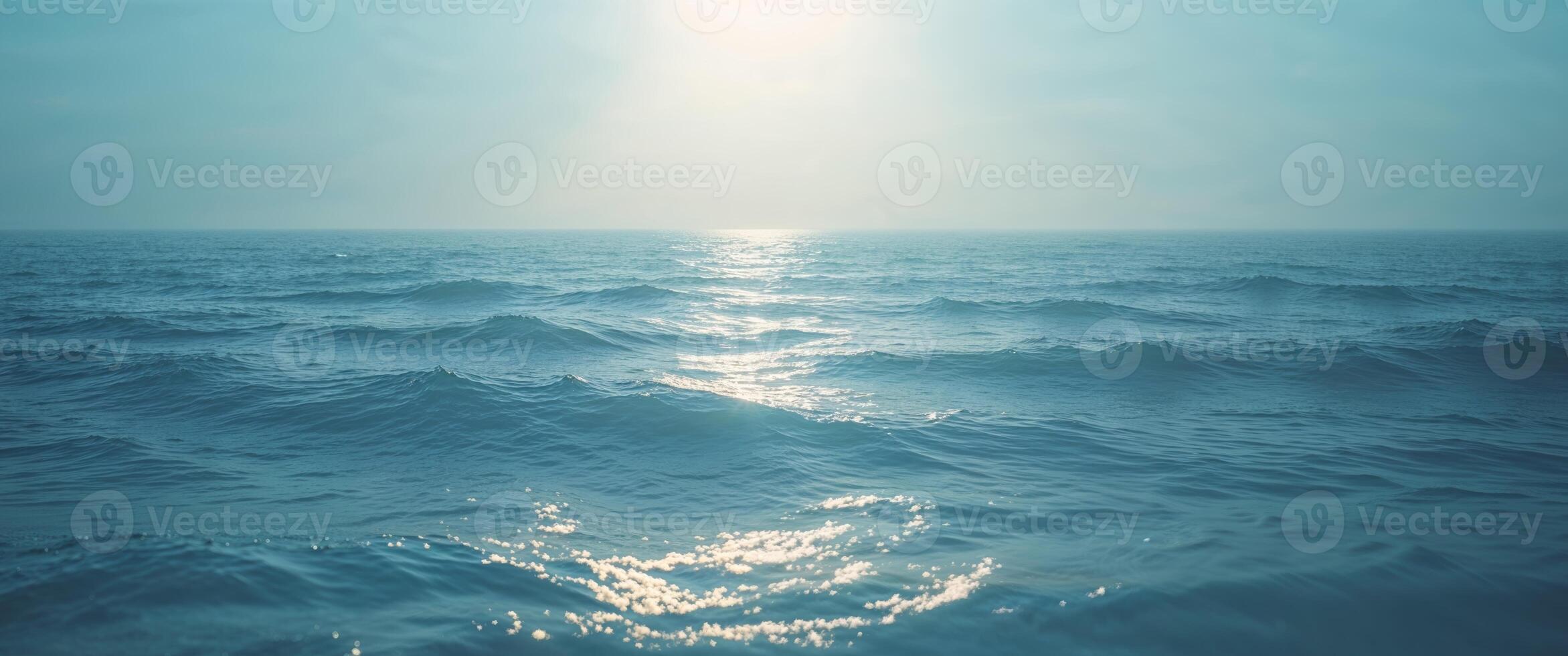 Deep Blue Ocean Background with Soft Sunlight Effects photo