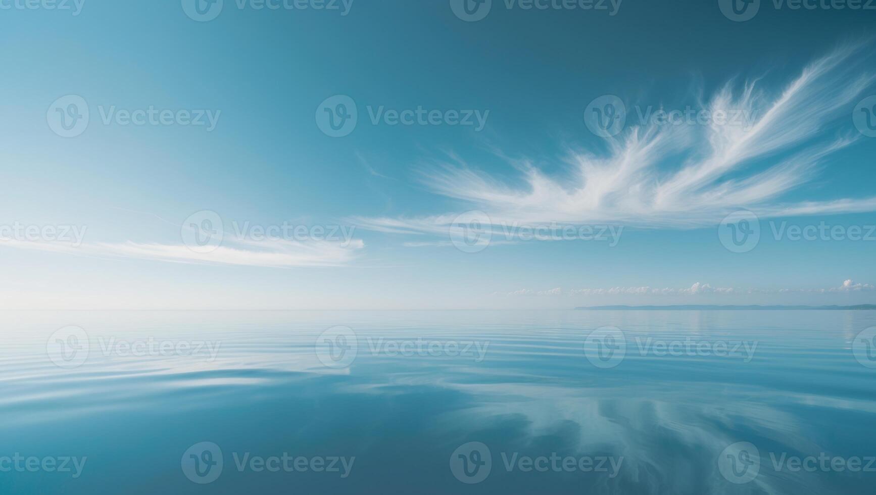 A large body of water is reflected in the sky. photo