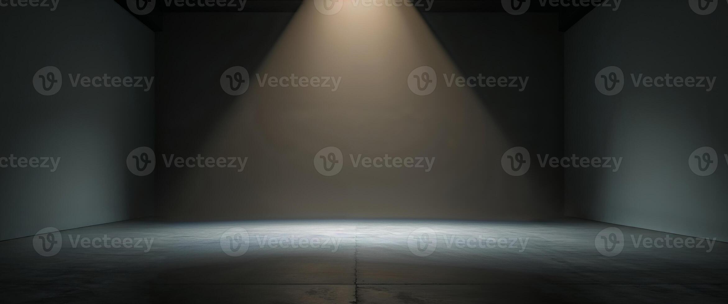 Soft beam of light illuminating an empty stage in a dimly lit room. photo