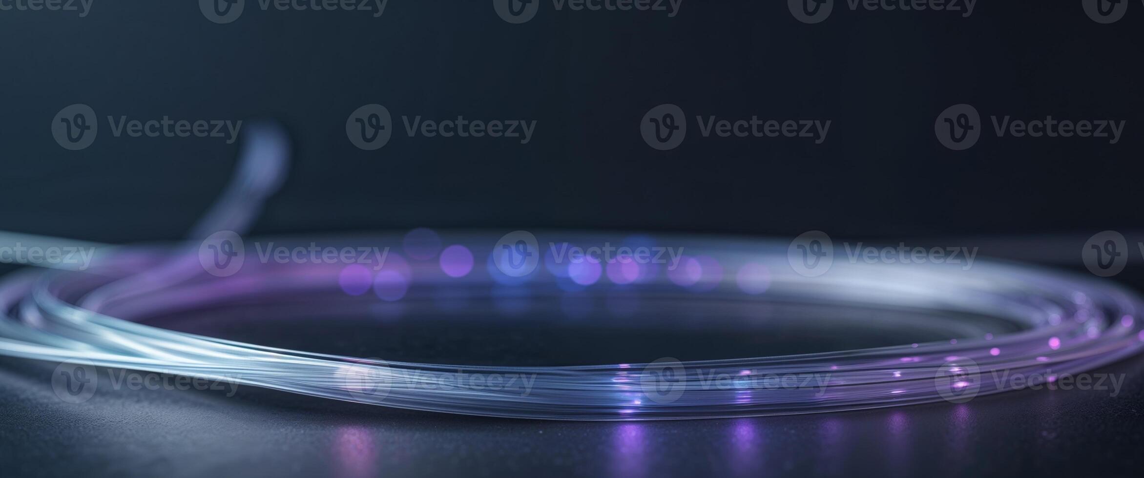 Fiber optic cables with glowing ends in dark background photo