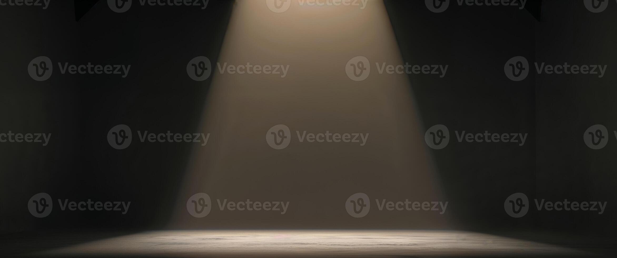 Soft beam of light illuminating an empty stage in a dimly lit room photo