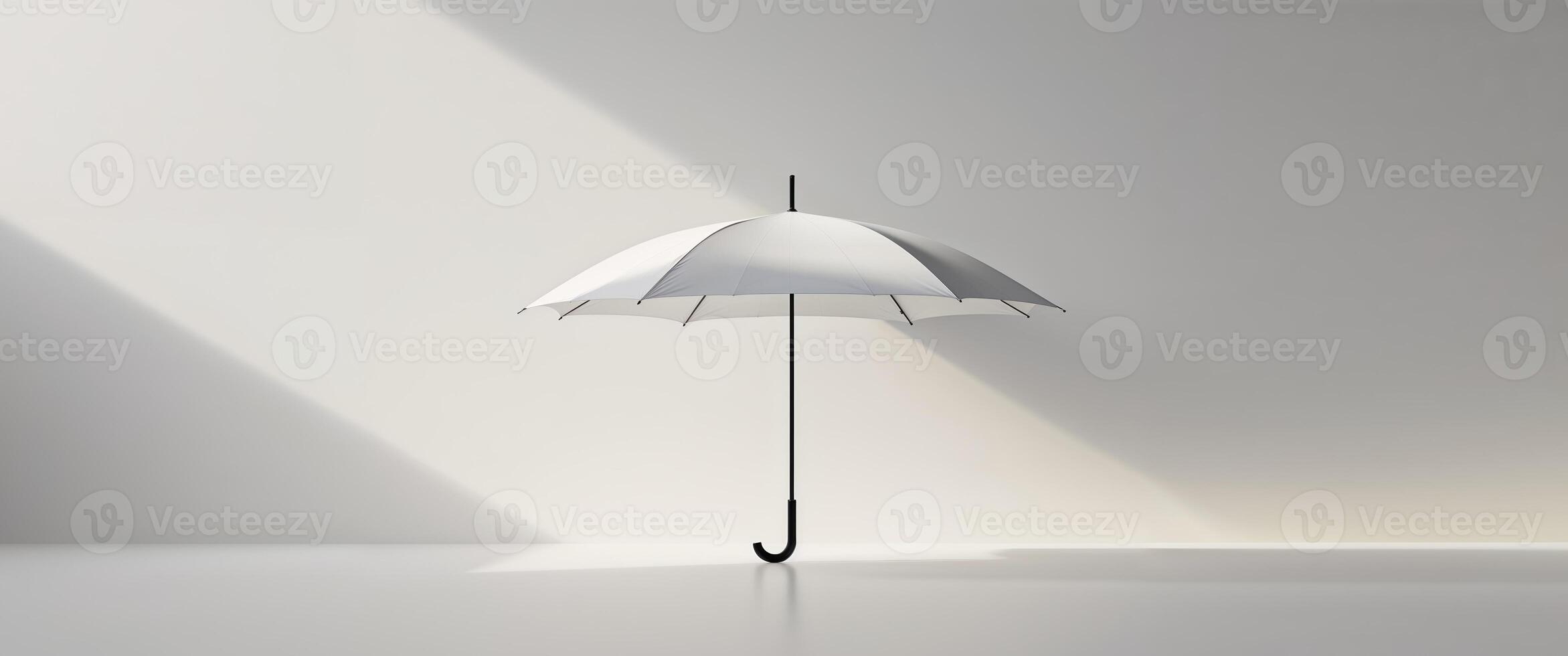 An umbrella is standing in front of a white wall photo