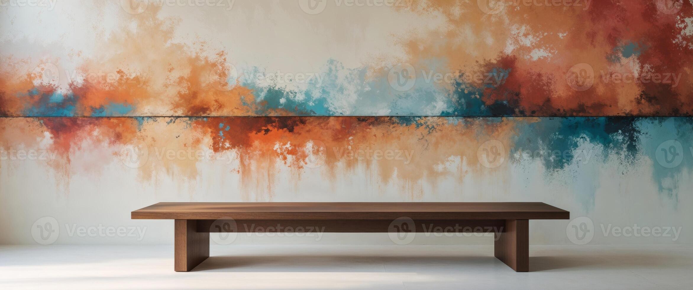 A bench in front of a large mural painted on the wall photo