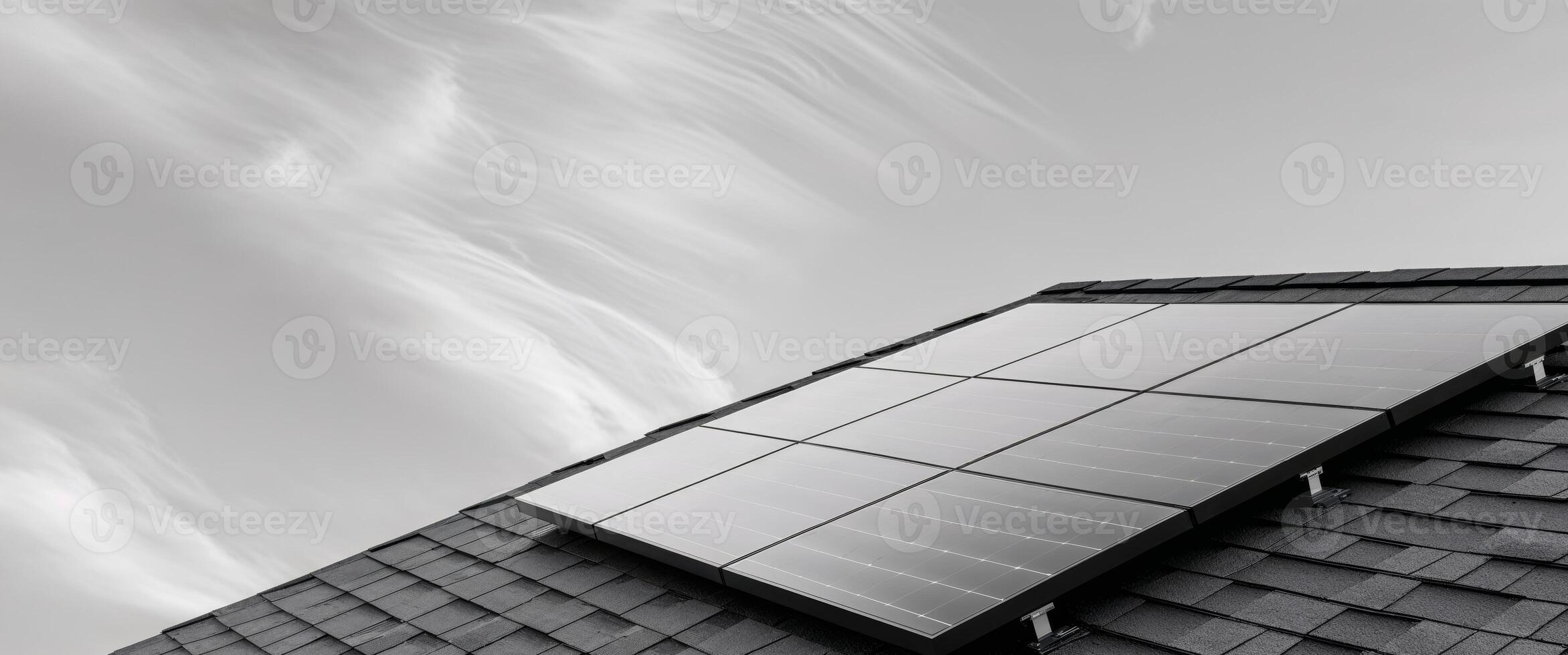 Black and white photo of solar panels on a roof