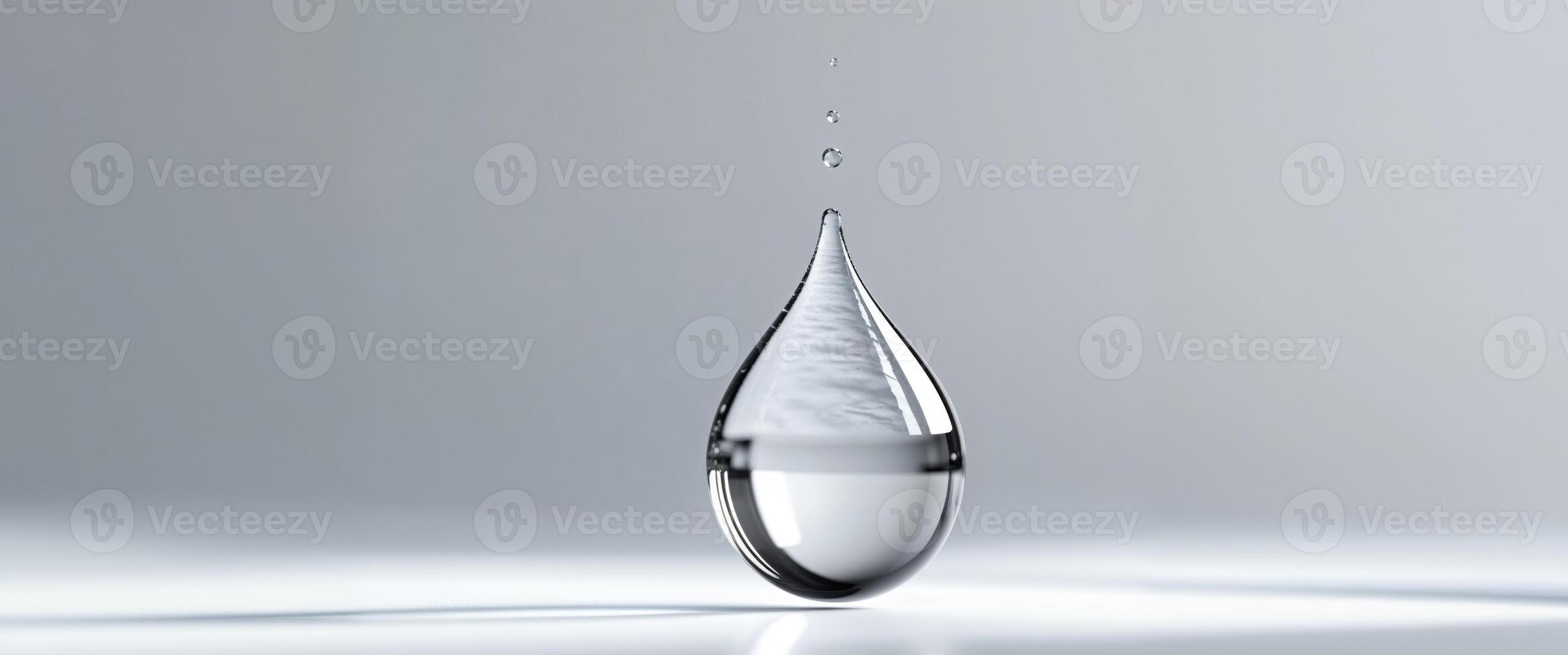 A clear drop of water with a sharp point. photo