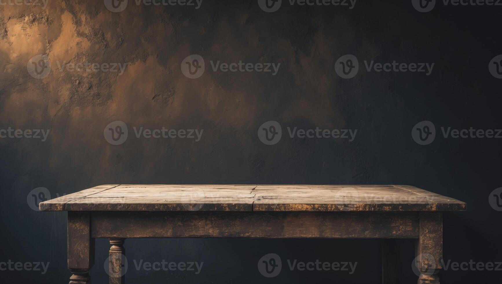 An old table in front of a dark wall photo