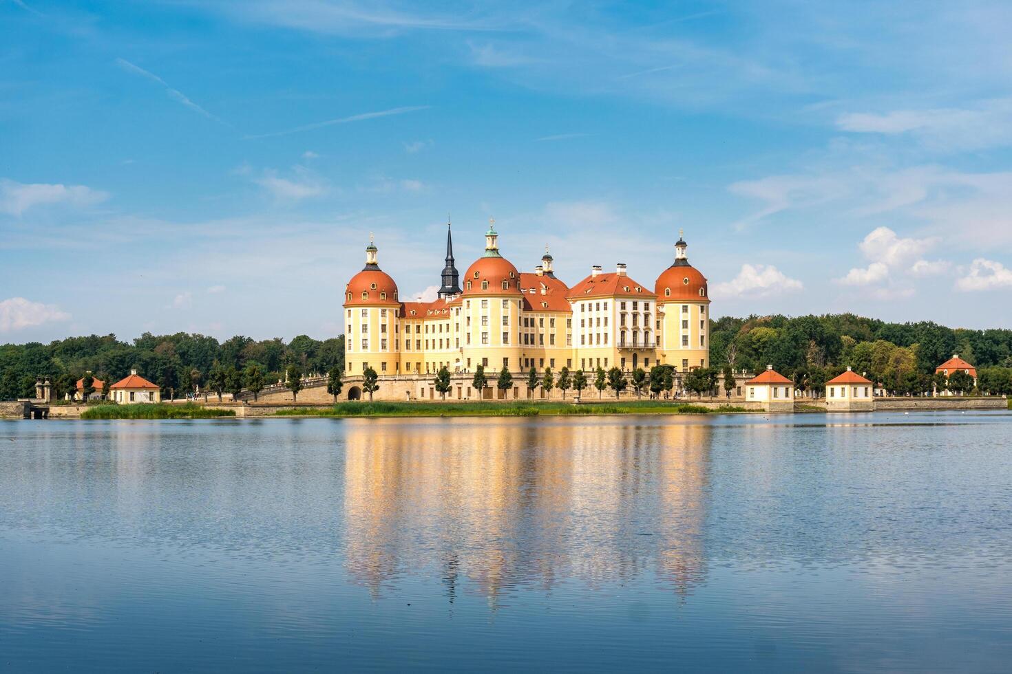 Moritzburg, Germany-august 17, 2022-View of Moritzburg castle surrounded by the lake on a sunny day photo