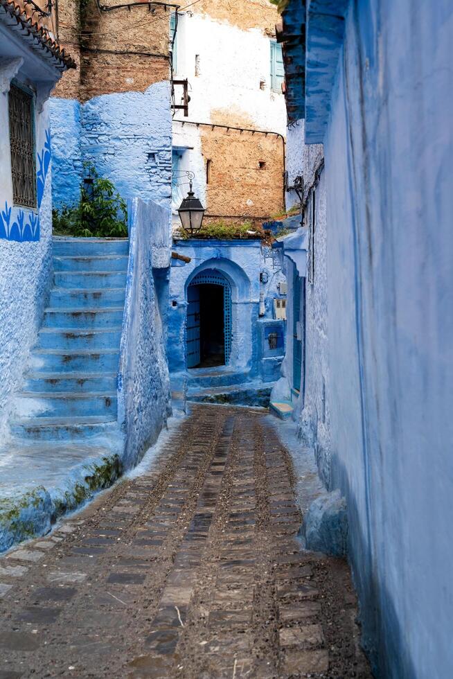 Chefchaouen, Morocco - march 26, 2024-particular of the narrow alleys in Chefchaouen the blue city during the cloudy day photo