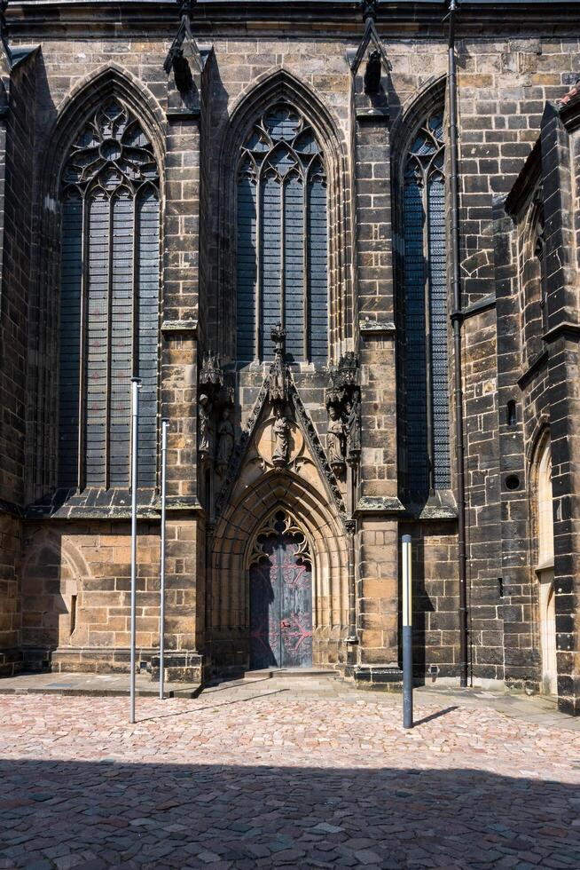 Meissen, Germany-august 17, 2022-small side entrance of Meissen Cathedral seen from below on a sunny day photo
