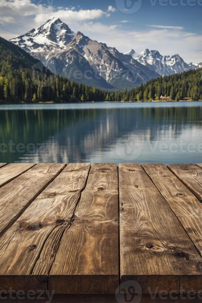 Majestic Mountains Reflecting in Lake with Rustic Wooden Tabletop Overlay photo