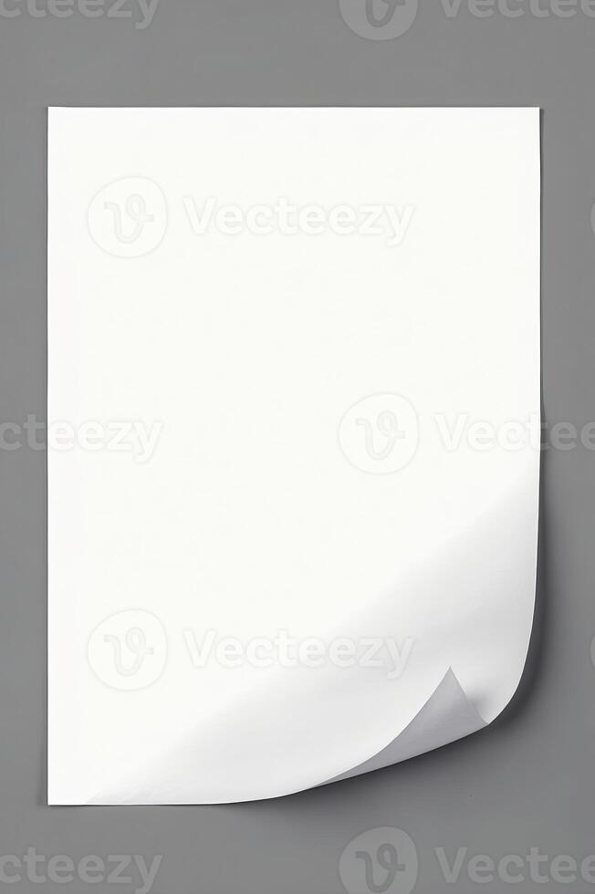 Isolated White Paper with Folded Corner on Gray Background for Mockups photo