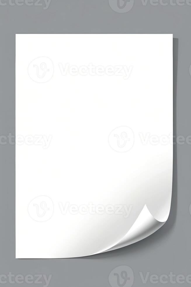 Blank White Paper Sheet with Folded Corner on Gray Background photo