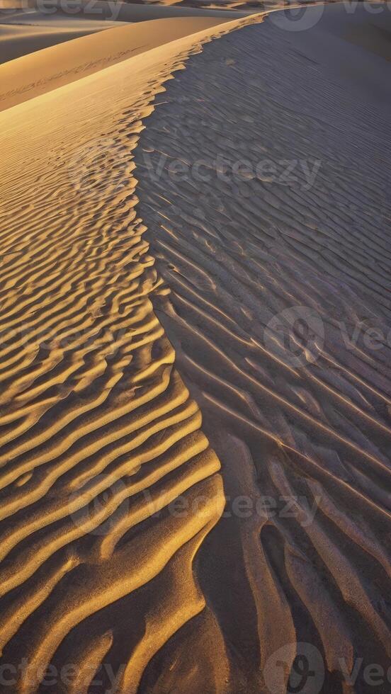 Sand Dune Ripples and Patterns at Golden Hour in Desert Landscape photo