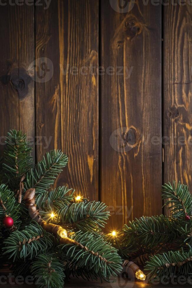 Festive Green Pine Branch and Warm String Lights Against Rustic Wood Backdrop photo