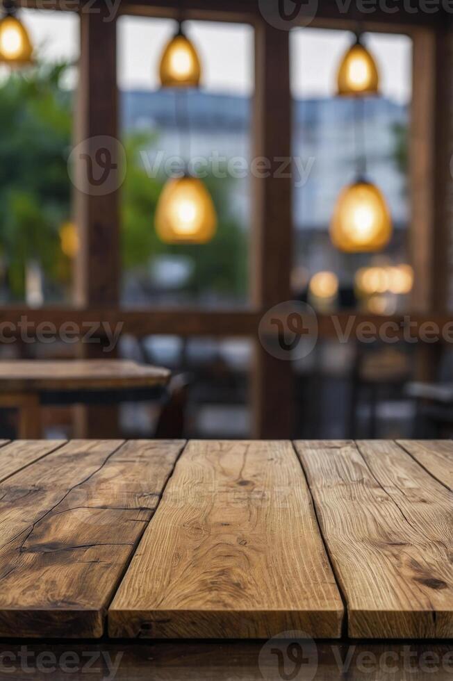 Rustic Wooden Table in Cafe Restaurant with Blurred Window and Lights photo