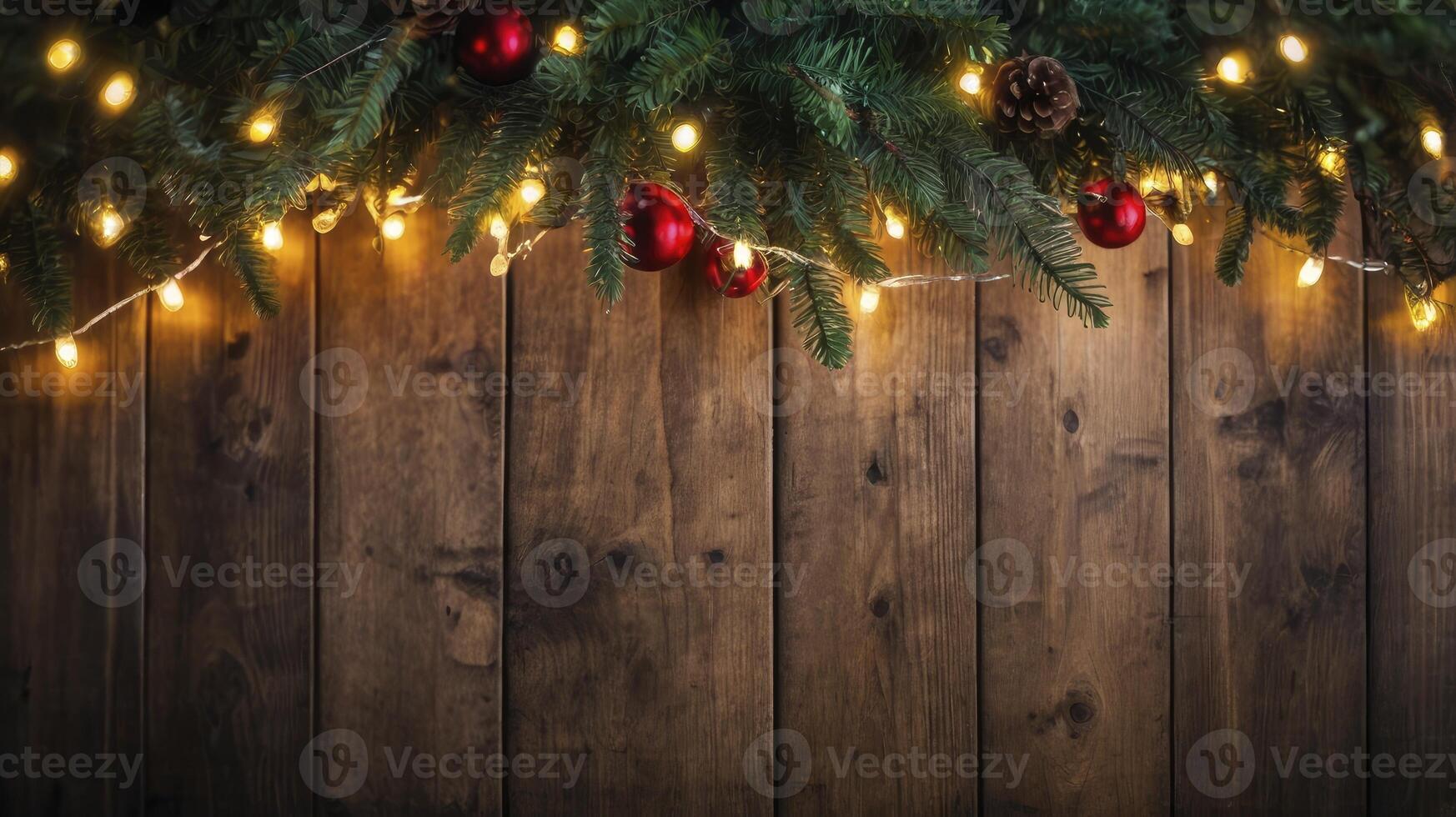 Christmas Decoration with Pine Branches, Red Ornaments, and String Lights on Wood photo