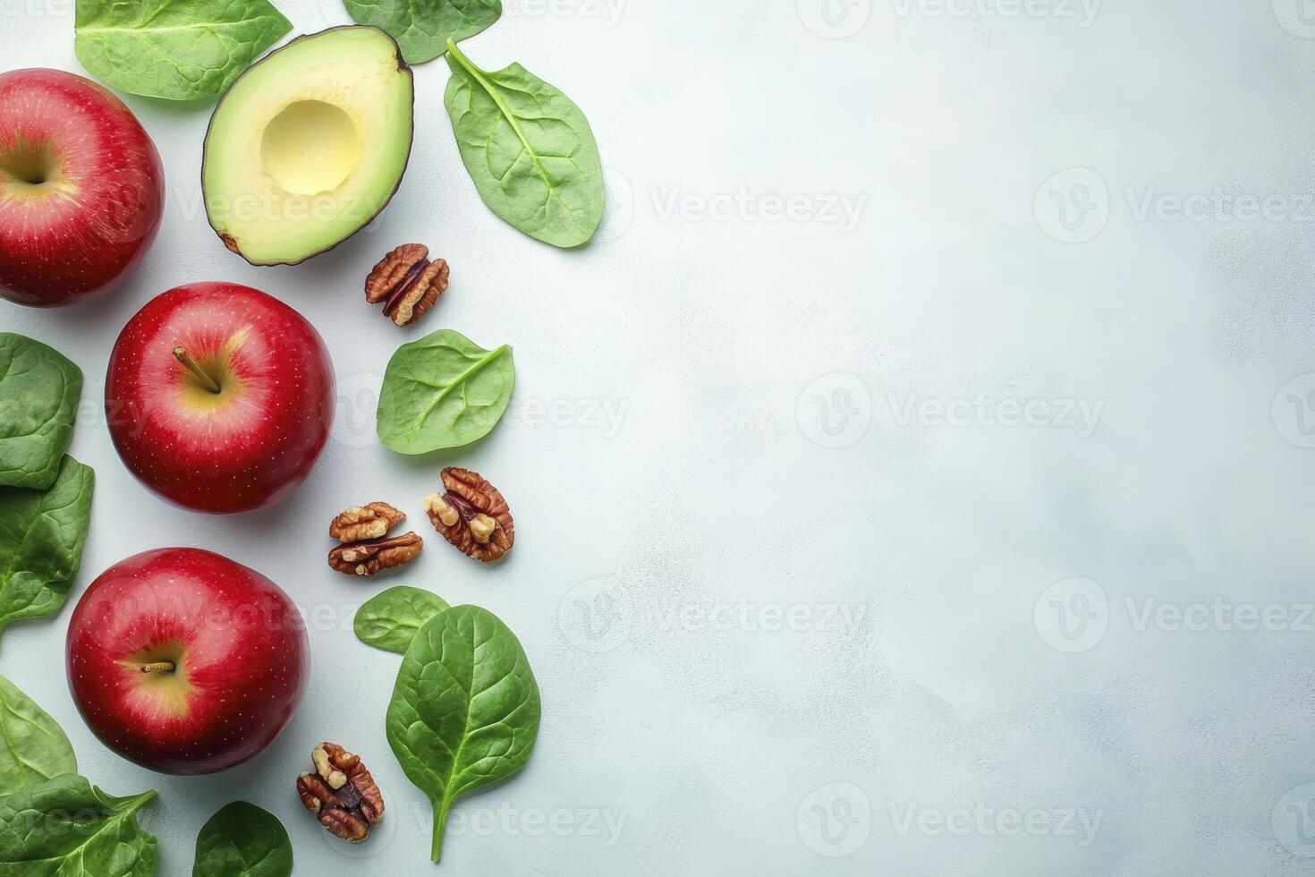Apples, Avocado, Pecans and Spinach Leaves Flat Lay on Background photo