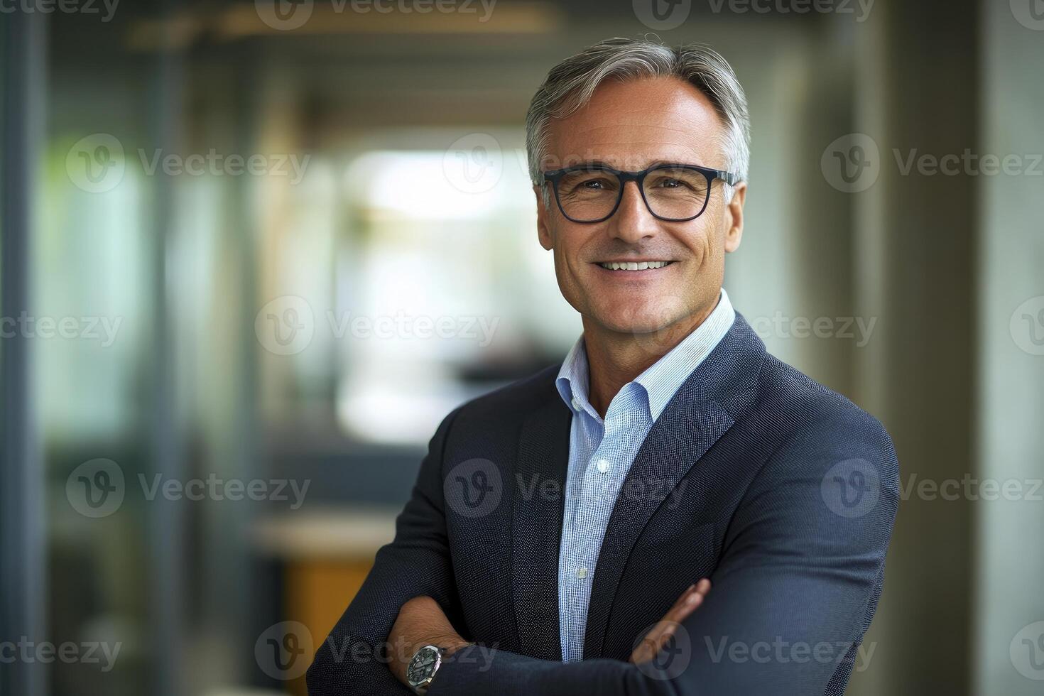 Smiling Mature Businessman Posing Confidently with Arms Crossed in Modern Office photo