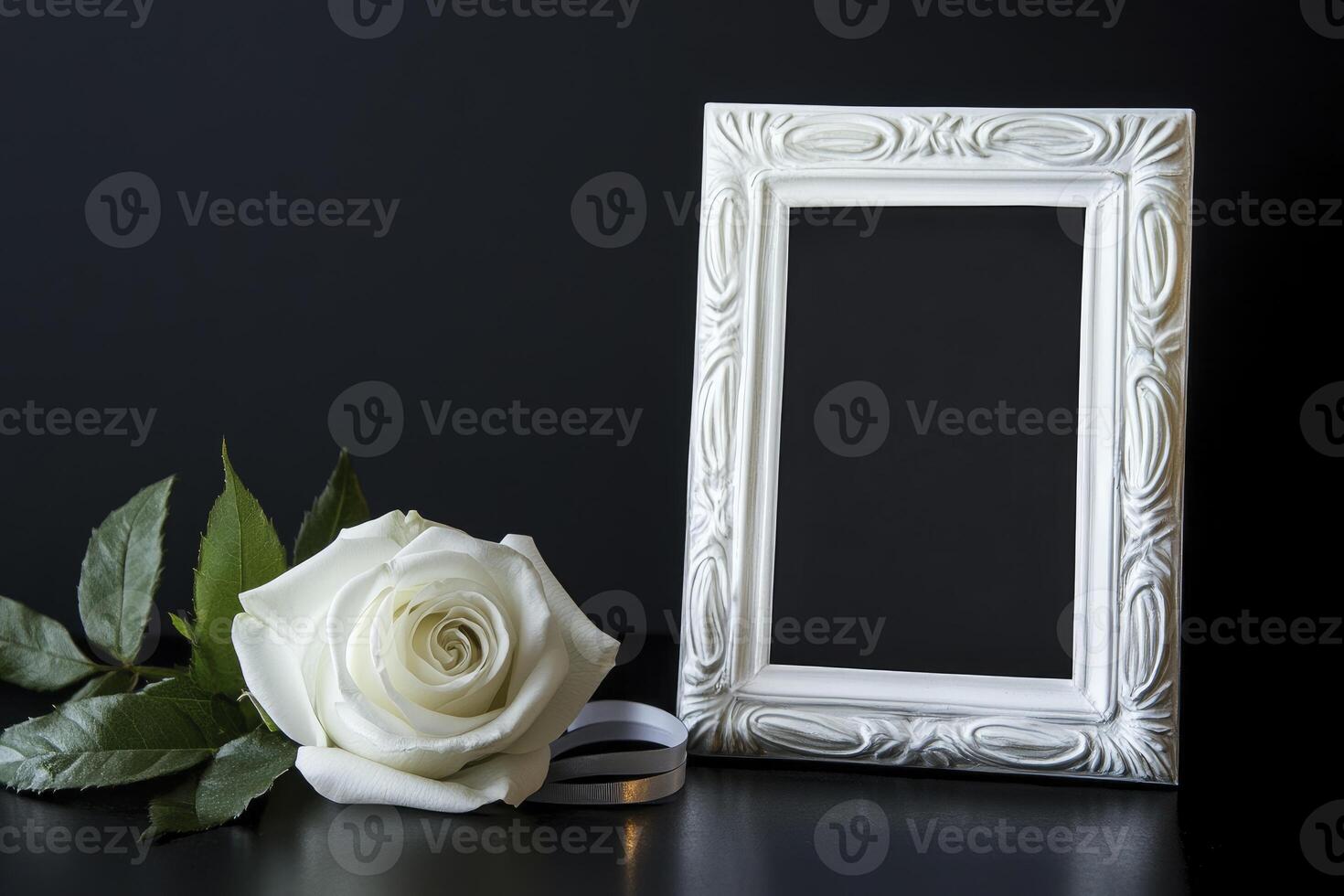 White Rose and Picture Frame on Black Background for Memorial Service photo
