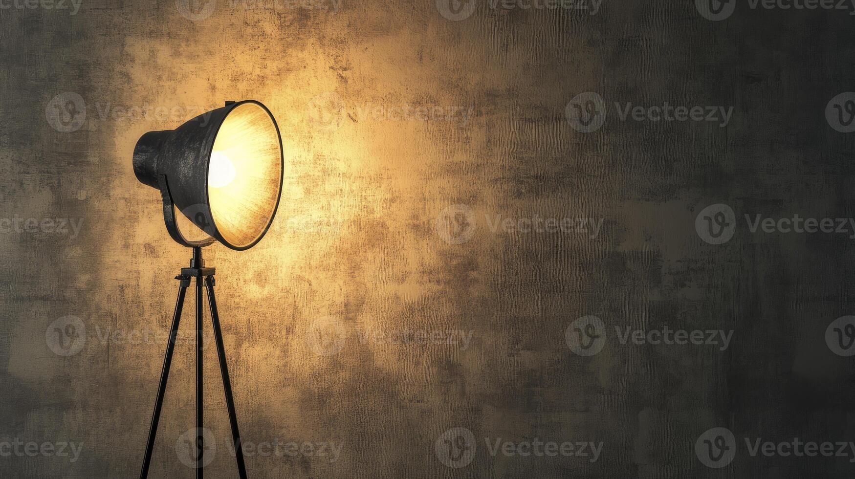 Studio Spotlight Illuminating a Textured Wall Creates a Dramatic and Moody Setting photo