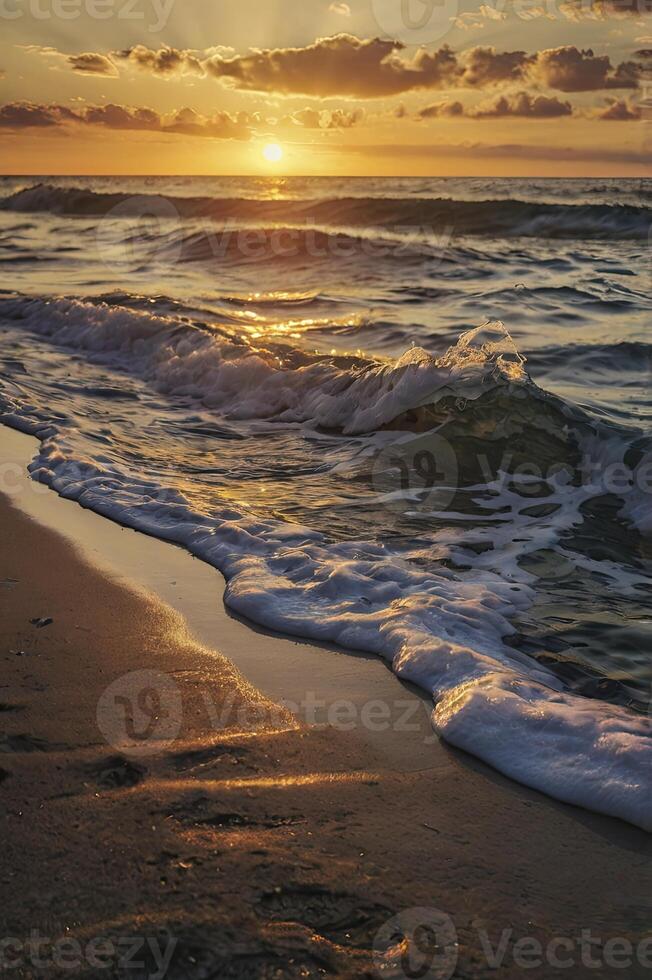 Waves Crashing on Sandy Beach at Sunset with Golden Light Rays photo