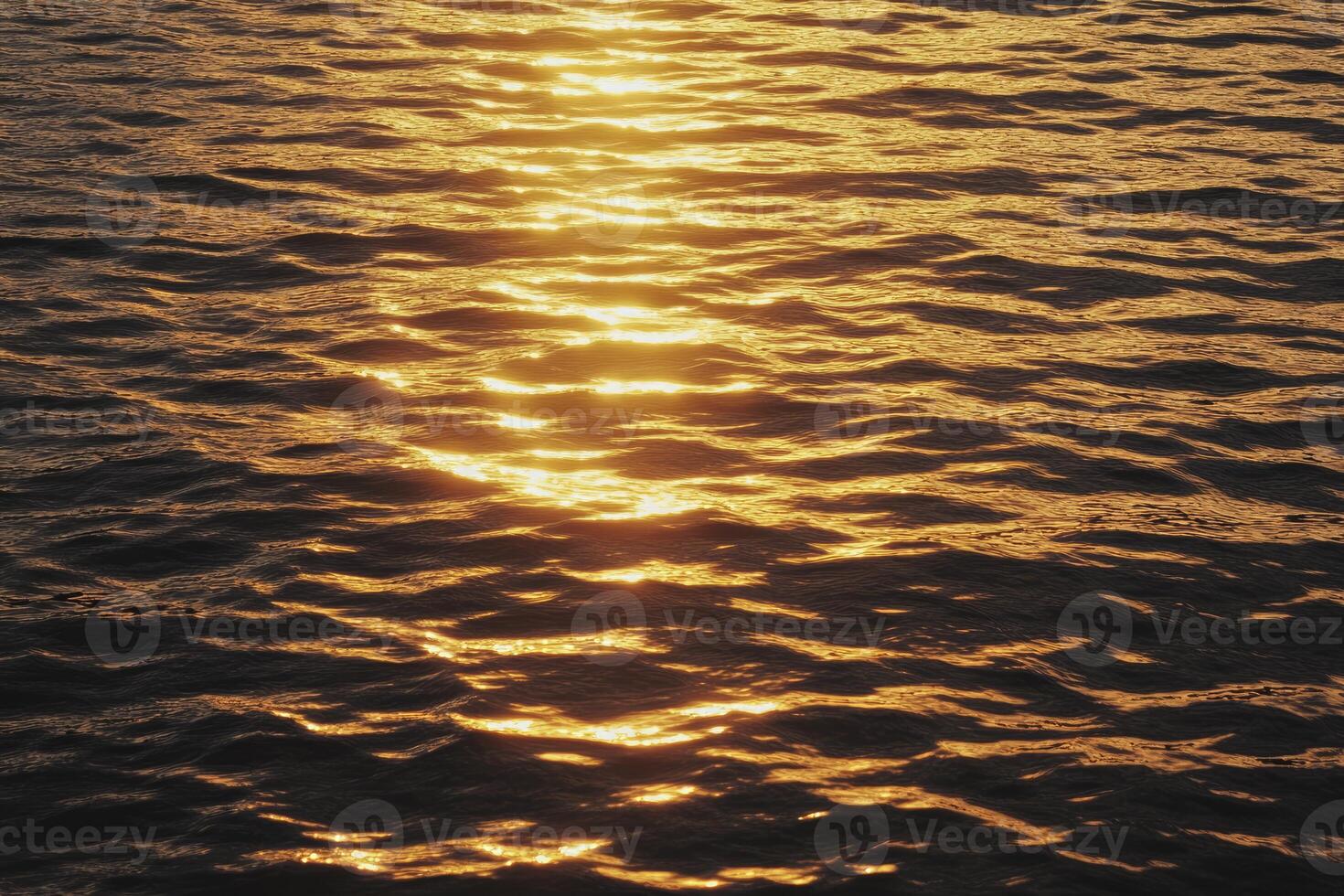 Sunlight Reflecting on Water Surface Creating Beautiful Golden Shimmer Effect photo