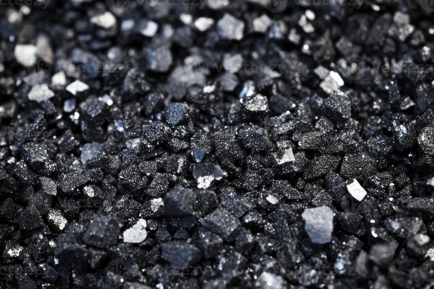 Close-up of Black Sand Texture with Shiny Particles for Backgrounds photo