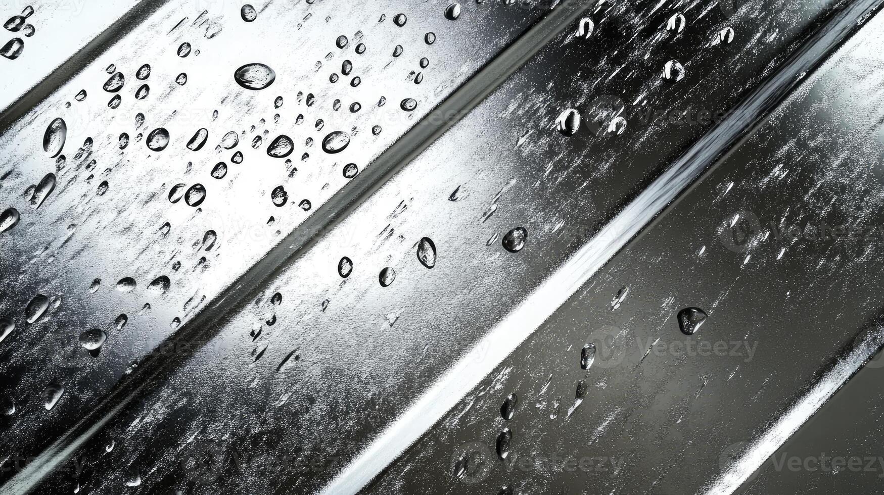 Water Droplets on Metal Surface with Shiny Texture After Rain photo